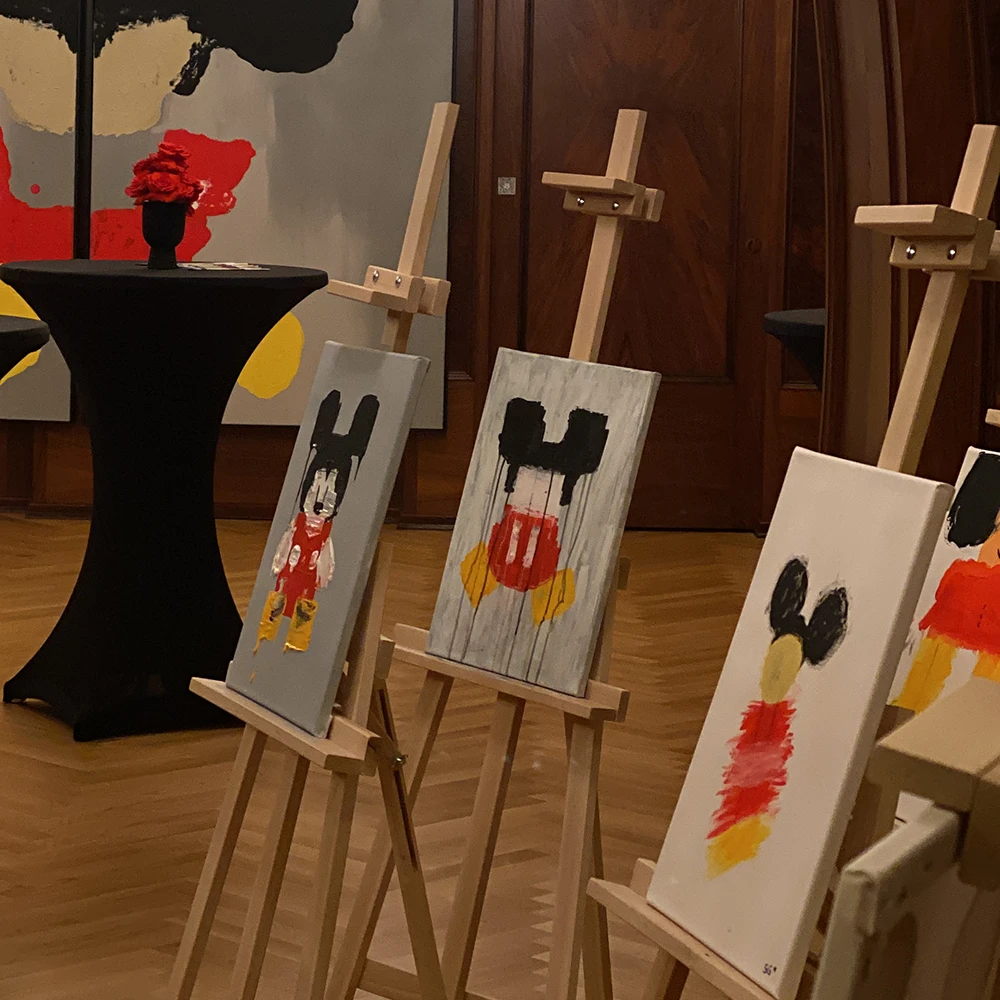 3 easels with pictures of Mickey Mouse